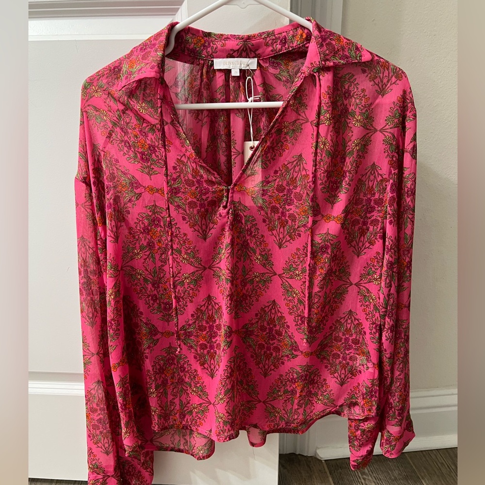 Brand new long sleeve sheer pink top. Floral design.